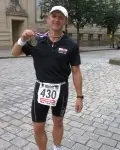Auditel�s Ironman Alan Ford raises more than �2,000 for Cancer Research